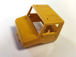 Kabina Mercedes Unimog žlutá